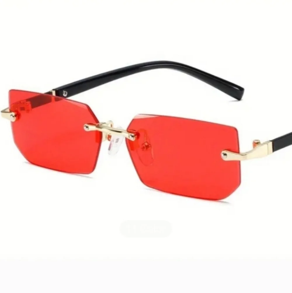 Red and Black Rimless Sunglasses with Metallic Accents